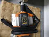 an orange and black blower sitting on top of a cardboard box