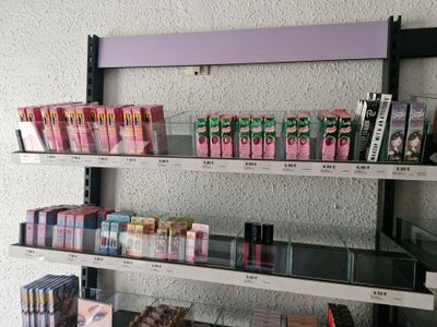a lot of cigarettes on the shelves in the store