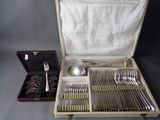 a case with silverware inside of it on a table
