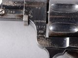 a close up of a gun with a metal handle
