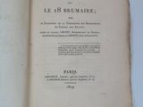 a book open on a white table with a black and white picture