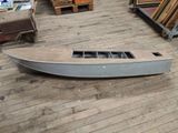 a boat that is sitting on the floor in a room