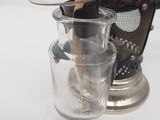 a glass jar with a toothbrush in it and a glass jar with a toothbrush in it
