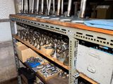 a lot of tools on a shelf in a room