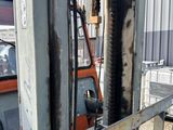 a fork lift truck parked in front of a building