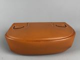an image of a brown case sitting on top of a table
