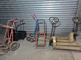 many different types of hand trucks in a garage