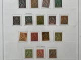 a framed picture of a collection of stamps on a wall