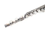 a close up of a silver flute on a white background