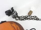 an orange ball with a chain around it and a light bulb attached to it