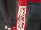 a red fire hydrant that has a sign on it