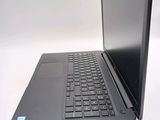 a black laptop computer sitting on a white surface