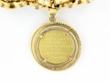 an image of a close up of a gold chain with a coin on it
