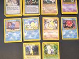 the pokemon cards are all lined up on the table