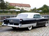 a black and white car parked on the side of the road