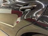 a close up of a car door handle on a car