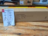 a cardboard box on a wooden table with a price tag on it