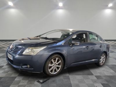 a picture of a blue toyota prius parked in a garage