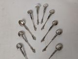 a lot of spoons arranged in a circle on the table