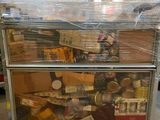 a cart that has many items on it in the warehouse