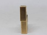 an image of a gold tie bar on a white background