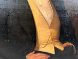 painting of a man in a tuxedo with a white shirt and yellow vest