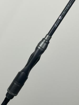 a close up of a fishing rod on a white background
