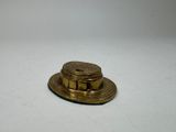 a small gold hat on a white surface