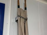 a pair of umbrellas hanging on the wall next to a blue door