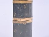 an image of a black and gold box on a white background