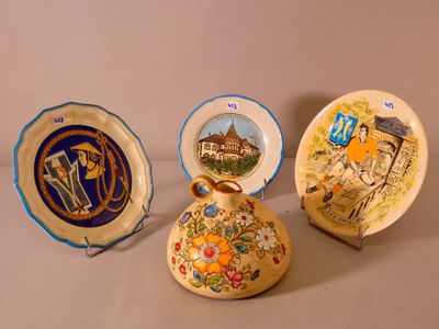 three decorative plates sitting on a table next to each other