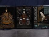 three framed paintings of women in oriental dress sitting on a chair