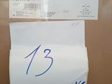 a receipt on a cardboard box with a smiley face on it