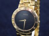 an image of a close up of a wrist watch on a stand