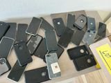 many cell phones that are sitting on a table