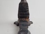 a small metal fire hydrant that is on a table