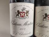 two bottles of wine sitting next to each other on a table