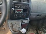 the interior of a car with a steering wheel and dashboard controls