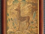 painting of a deer in a wood frame on a wall