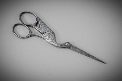 a close up of a pair of scissors on a table