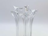 clear glass vase on a white table with a white background