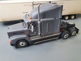a model of a semi truck with a trailer behind it