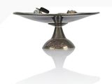a silver plate with a silver object on it