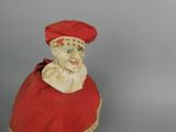 a figurine of a man wearing a red hat
