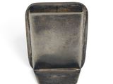 a small metal container with a handle on a white surface