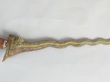a very long knife that is sitting on a table