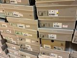 many boxes stacked on top of each other on the floor