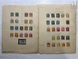 an open book with a lot of different stamps on it