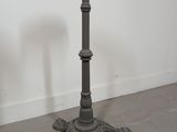 a pair of cast iron pedestals in the manner of person