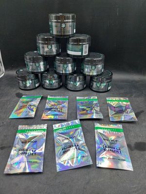 a group of packets of marijuana sitting on top of a table